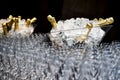 Moet & Chandon champagne tasting in event. Many glasses and bottles of champagne in to the ice with Moet & Chandon logo