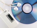 MP3 player, earbuds and CD Royalty Free Stock Photo