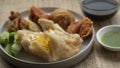 Mpek-Mpek Kapal Selam and Adaan with vinegar sauce and green chili in a cup. Royalty Free Stock Photo