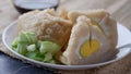 Mpek-Mpek kapal selam on a white plate, is a fish cake, tradisional food from Palembang city. Royalty Free Stock Photo