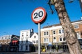 20mph Road Speed Limit Traffic Sign Against A Blue Sky With No People Royalty Free Stock Photo