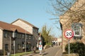 20MPH slow speed traffic sign seen in a nearby pedestrian zone. Royalty Free Stock Photo