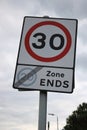 30 MPH speed limit sign with end marker of the 20 MPH zone UK Royalty Free Stock Photo