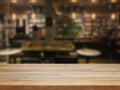 Mpty wooden table and blurred cafe background
