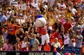 Mr. Met throws tee shirts.