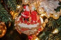Mr and Mrs Santa kissing retro really old Christmas decoration of colloid and styrofoam and beads and trim hanging from a tree - Royalty Free Stock Photo