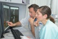 mri machine and screens with doctor and nurse