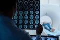 MRI scan images being examined by a doctor Royalty Free Stock Photo