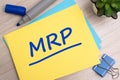 MRP - Marketing Research Planning - acronym text concept with marker on yellow business card Royalty Free Stock Photo