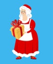 Mrs. Claus and gift. Wife of Santa Claus and box. Christmas woman in red dress and white apron. Xmas feale