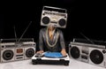 Woman with ghettoblaster as a head Djing