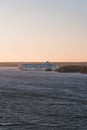 MS Galaxy in the archipelago between islands at sunset, heading to Stockholm from Turku