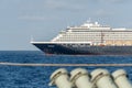 MS WESTERDAM, cruise ship owned by Holland America Line sails in the sea during the trip to Thailand with parts of another ship on Royalty Free Stock Photo