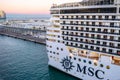 MSC Fantasia Cruise Ship docked at the Barcelona Cruise Port Terminal at sunset with W Barcelona Hotel in background Royalty Free Stock Photo