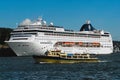 MSC Lirica cruise ship in the sea port of Oslo city with the local ferry boat at the foreground in in Oslo, Norway.