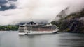 MSC Splendida cruise ship in a fjord in Norway during overcast weather Royalty Free Stock Photo