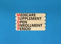 MSOEP symbol. Concept words MSOEP medicare supplement open enrollment period on wooden stick. Beautiful blue background. Medical