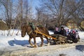 Mstera,Russia-February 21,2015: Children ride on sled with horse at festive day of the shrovetide