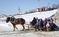 Mstera,Russia-February 21,2015: Children ride on sled with horse at festive day of the shrovetide