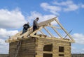 Mstera,Russia-September 14,2015:Construction of the premiseses from tree on background blue sky