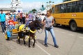 Mstyora,Russia-August 16,2014: Girl with pony carries small boy at day of the city