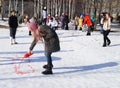 Mstyora,Russia-February 28,2014: Girl draws red water on snow