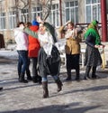 Mstyora, Russia-February 28, 2014: Girl in traditional triangular kerchief dances at day of the Shrovetide Royalty Free Stock Photo