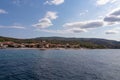 Mt Athos - Panoramic view from boat tour on Ouranoupolis town nd ancient Tower of Ouranoupolis on peninsula Mount Athos Royalty Free Stock Photo