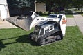 The MT55 Bobcat skid steer parked in the grass