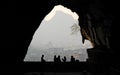View from a cave with people in silhouette on Mt Diecai in Guilin, Guangxi Province, China