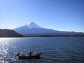 Mt. Fuji with a Boater Out on Lake in Front of Mountain