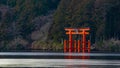 Mt Fuji and Hakone Shrine torii gate as seen from the lake Ashinoko during winter.