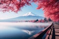 Mt Fuji at Kawaguchiko lake in Japan with red maple leaf. Colorful Autumn Season and Mount Fuji with morning fog and red leaves at Royalty Free Stock Photo