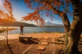 Mt. Fuji over Lake Kawaguchiko with autumn foliage and traveler woman at sunrise in Fujikawaguchiko Royalty Free Stock Photo