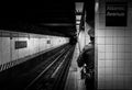 MTA police officer waiting for the train in Atlantic Avenue subway station, Brooklyn. A daily routine of NYPD.  Selective focus. Royalty Free Stock Photo