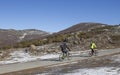 MTB bikers climbing mountain pass