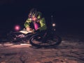Extreme orienteering bike race. Cyclist check map