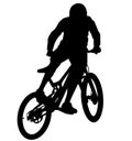 MTB downhill, enduro cross mountain biker doing an extreme jump on a mountain bike. MTB dh downhill mountain bike with helmet and