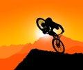 MTB / Mountain bike Downhill Backflip in the Mountains, landscape with the setting sun behind the mountains. without spokes at th Royalty Free Stock Photo