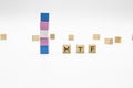 MTF lettering made of wooden cubes and transgender flag on white background. Conceptual illustration lesbian, gay, bisexual, and