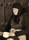 Old georgian woman ask for money.