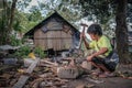 Indigenous Malaysian aboriginal craftman making a knife for hunting