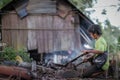 Indigenous Malaysian aboriginal craftman making a knife for hunting