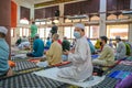 Muslim people offer Friday prayers at Muadzam Shah Mosque