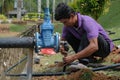 Muadzam Shah, Malaysia- September 1st, 2021 :Plumber installing new HDPE pipe in the main drains