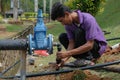 Muadzam Shah, Malaysia- September 1st, 2021 :Plumber installing new HDPE pipe in the main drains