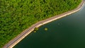 Muak Lek reservoir in Saraburi from aerial bird eye view. Beautiful unseen nature at Muak Lek dam with roadway beside with water a