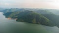 Muak Lek reservoir in Saraburi from aerial bird eye view. Beautiful unseen nature at Muak Lek dam with roadway beside with water a