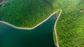 Muak Lek reservoir in Saraburi from aerial bird eye view. Beautiful unseen nature at Muak Lek dam with roadway beside with water a