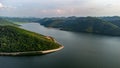 Muak Lek reservoir in Saraburi from aerial bird eye view. Beautiful unseen nature at Muak Lek dam with roadway beside with water a